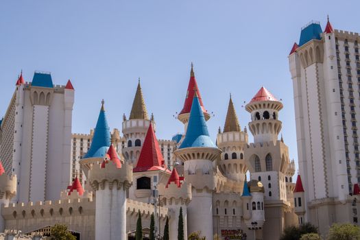 Vibrant castle-themed Excalibur Hotel in Las Vegas under a clear blue sky.