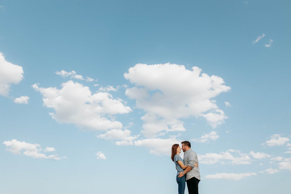 A Couple Kissing under the Blue Sky