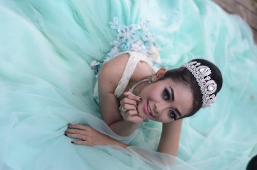 Free Woman Wears Teal Chiffon Gown and Crown Stock Photo