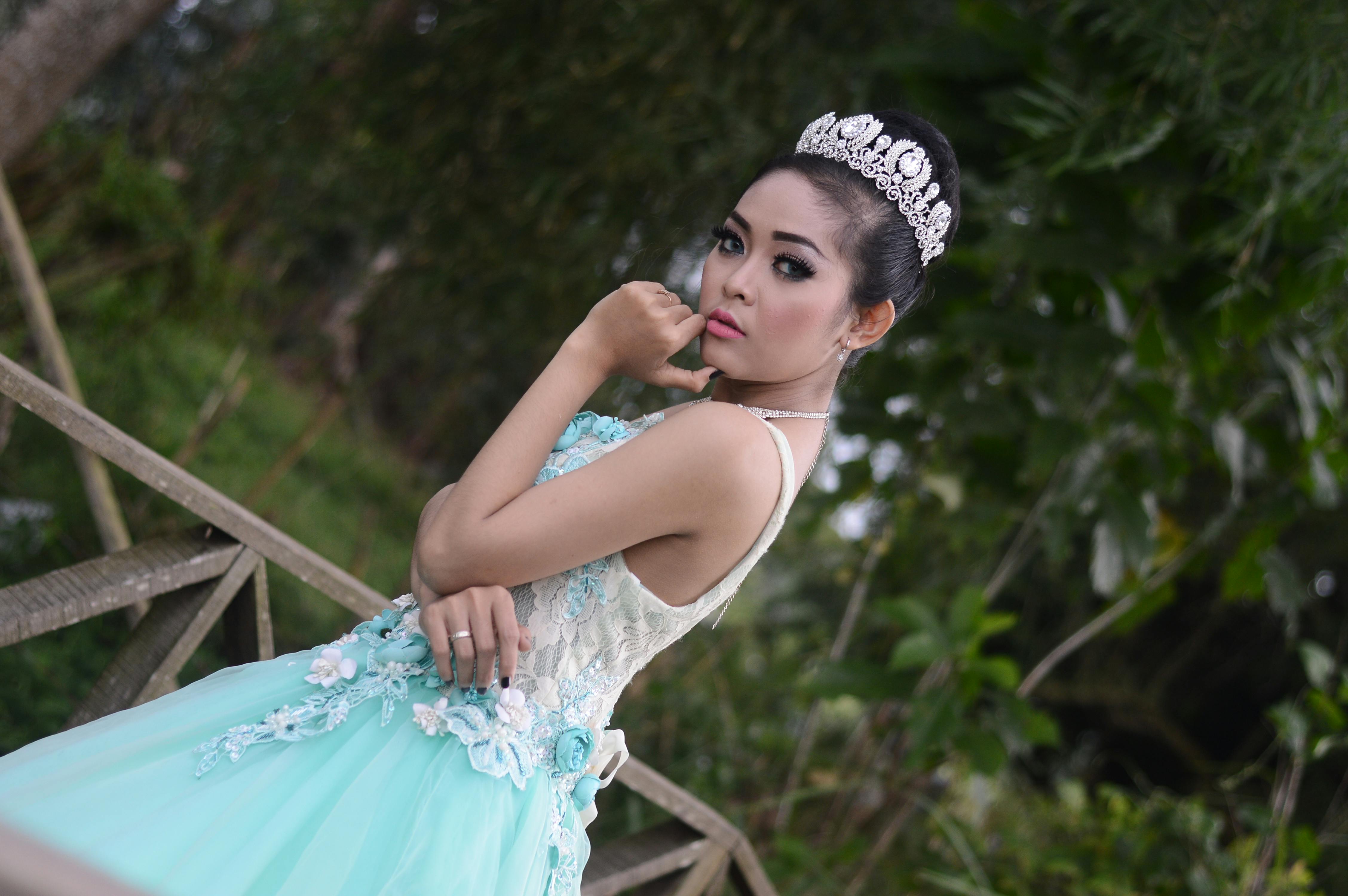 Person holding a book and laptop