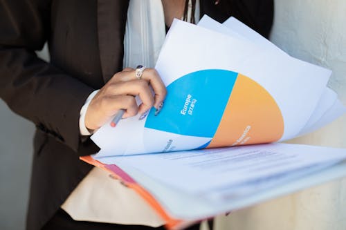 A Person Holding Documents