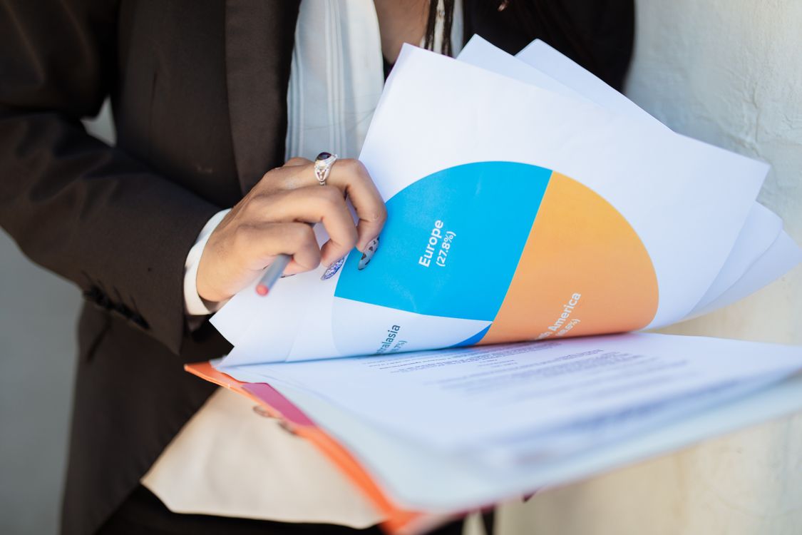 A Person Holding Documents · Free Stock Photo