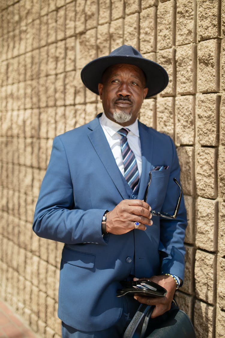 A Portrait Of A Man In A Stylish Blue Suit