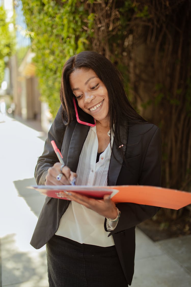 A Woman Writing In The Document