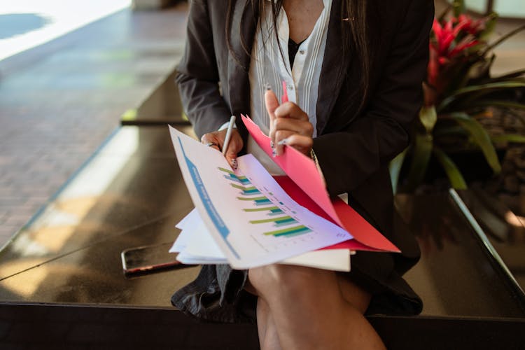 A Woman Holding Documents