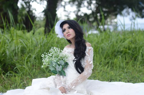 Woman Wearing of White Off-shoulder Bridal Dress