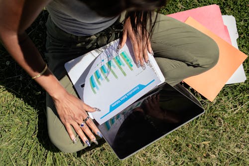 Woman with Long Nails Looking at Documents