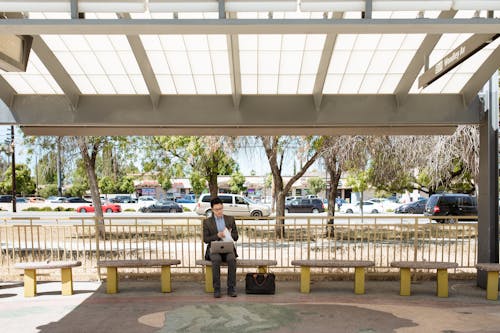 Free Man Working on a Bus Stop Stock Photo
