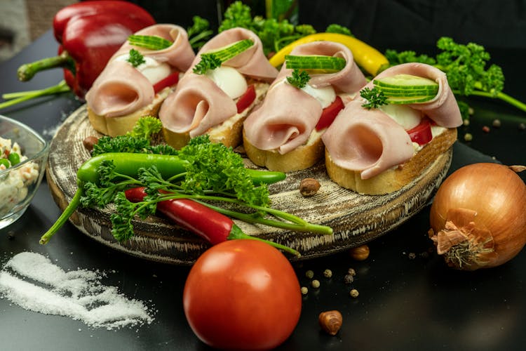 Ham Sandwiches On A Wooden Plate