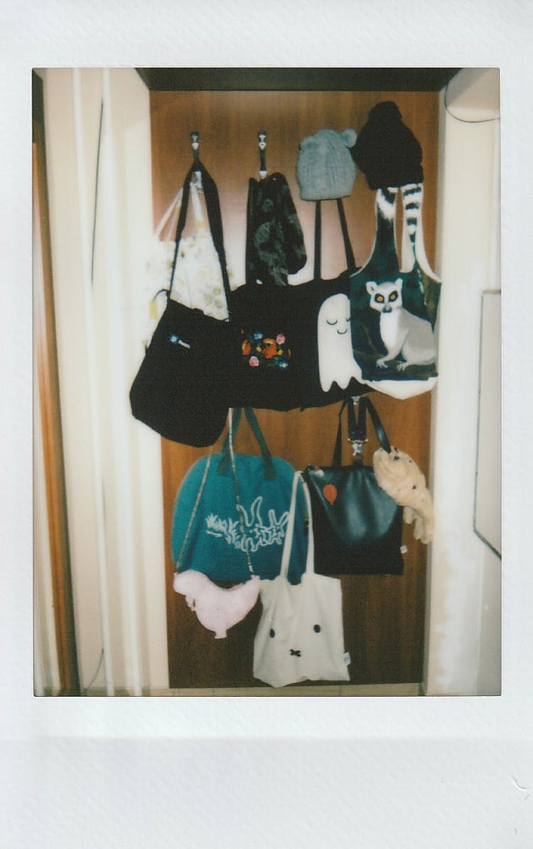 Various Tote Bags Hanging By Entrance