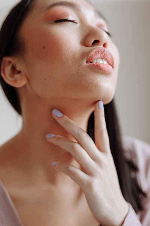 A Woman with Touching Her Chin