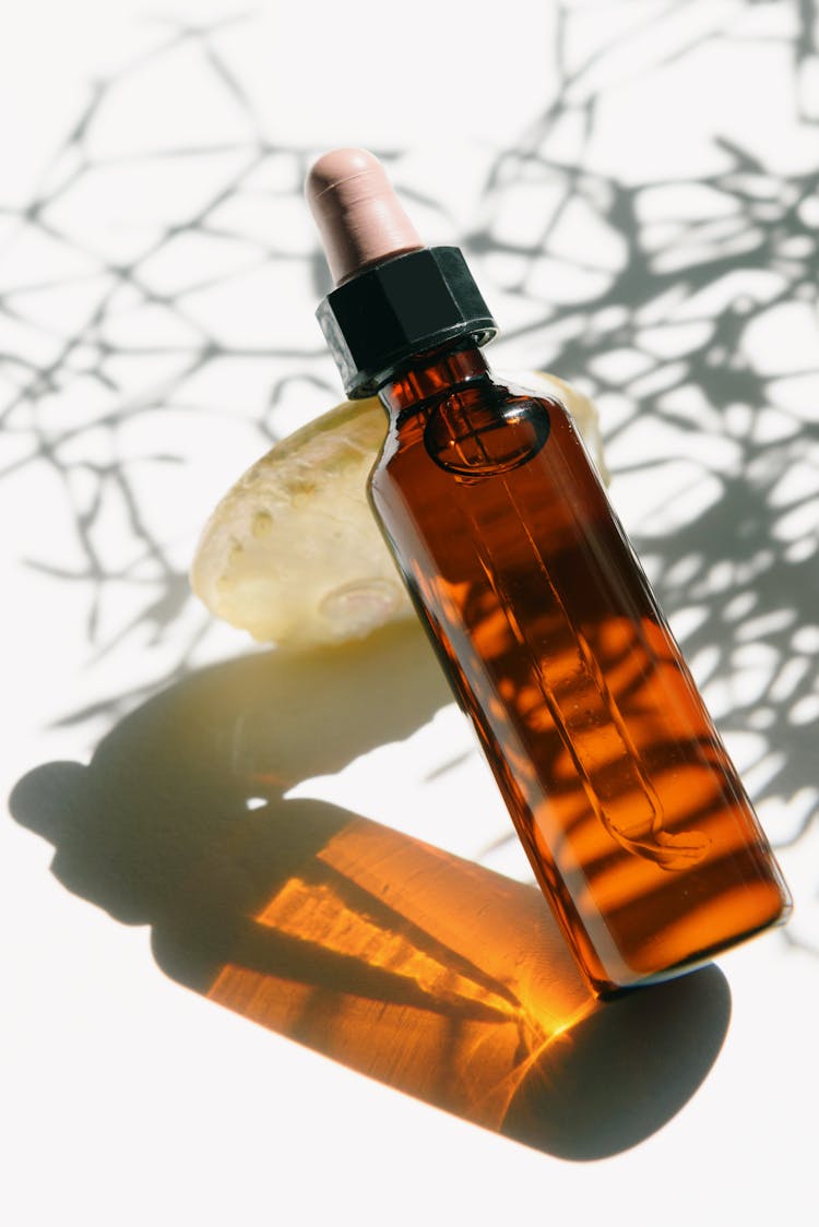 Bottle Of Essential Oil In Close-up Shot