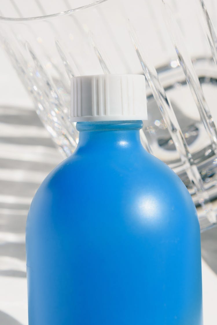 Blue Plastic Bottle With White Cap