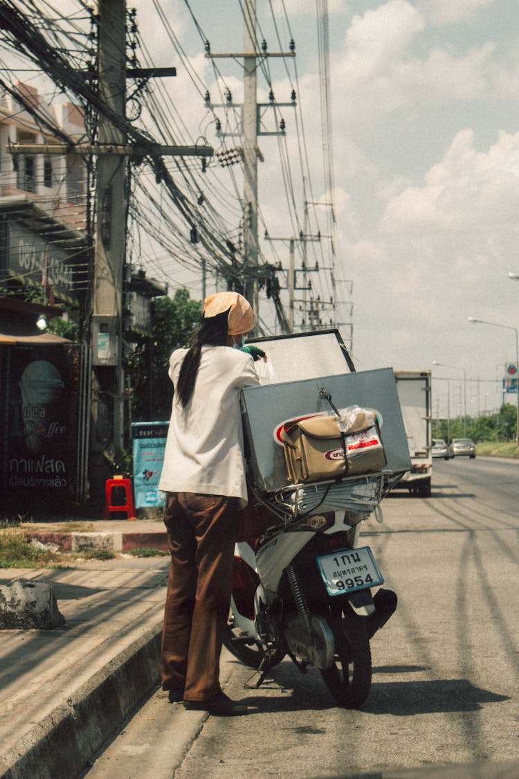 Person Opening A Delivery Bag