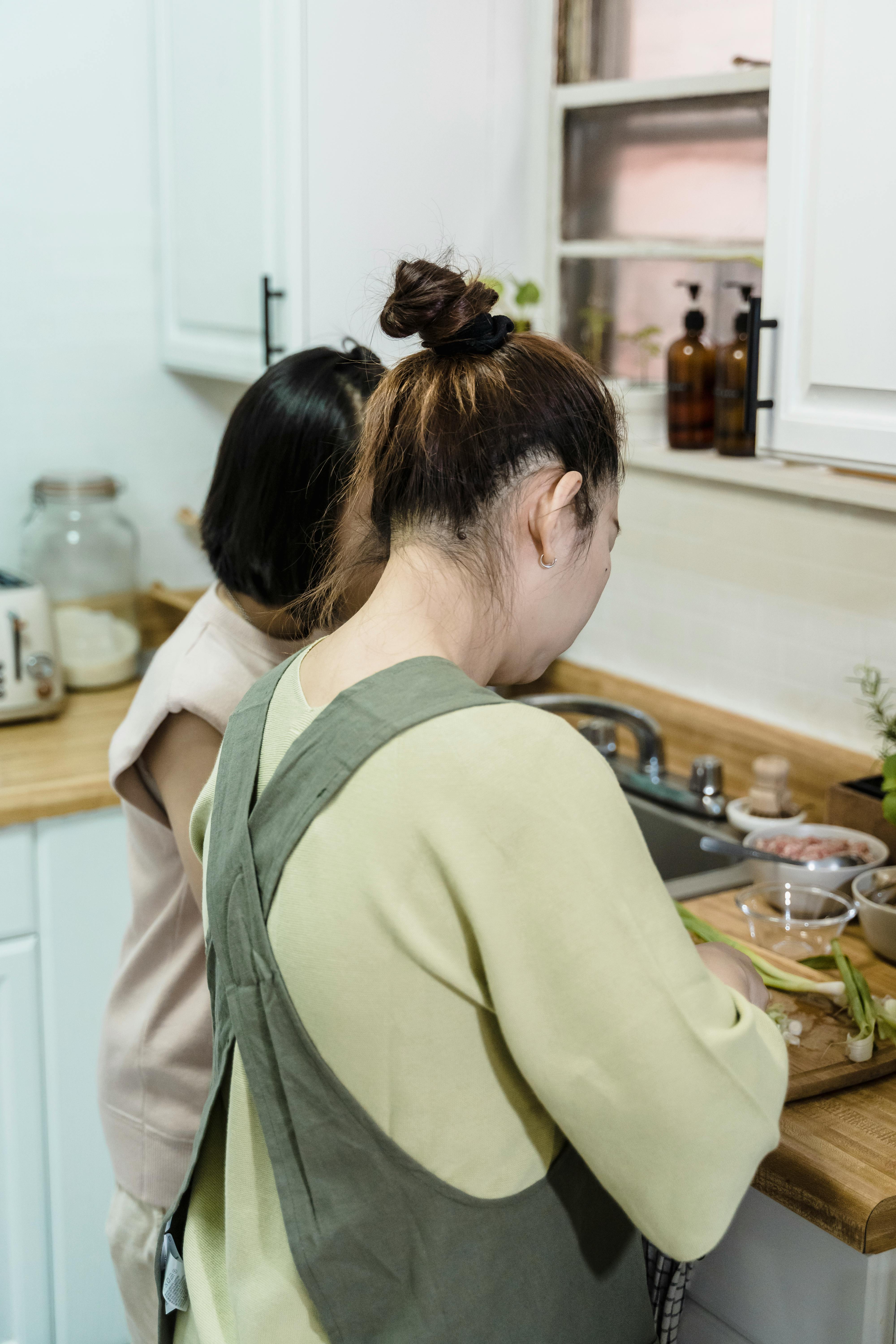 women preparing food in the kitchen