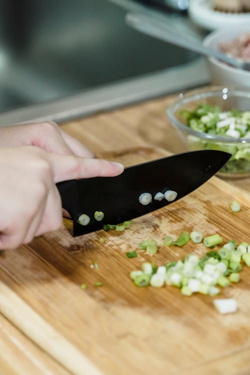Female Hand Cutting Vegetables