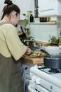 Man in Beige Long Sleeve Shirt Cooking Food