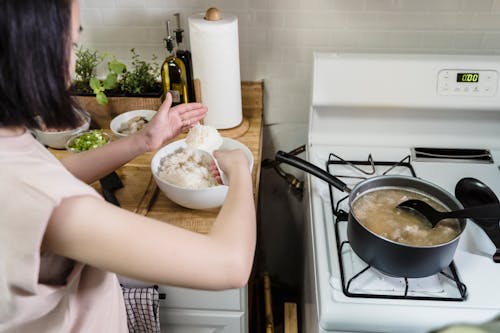 Free Person Holding White Ceramic Bowl With Rice Stock Photo