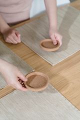 Cork coaster on a table, photo by Annushka Ahuja on Pexels