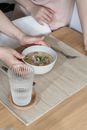 Person Holding White Ceramic Bowl With Green Vegetable