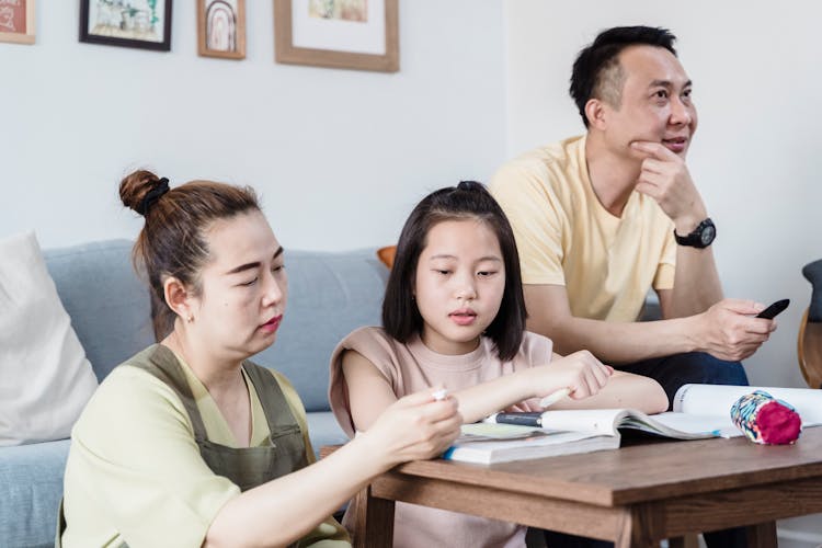 Mother Helping Daughter With Homework