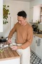 A Man Preparing Food in a Kitchen