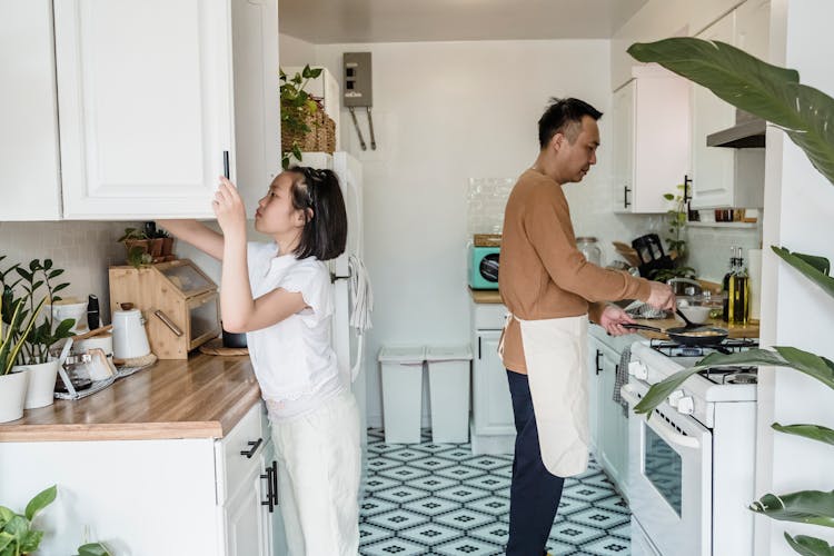 A Man Cooking At The Kitchen