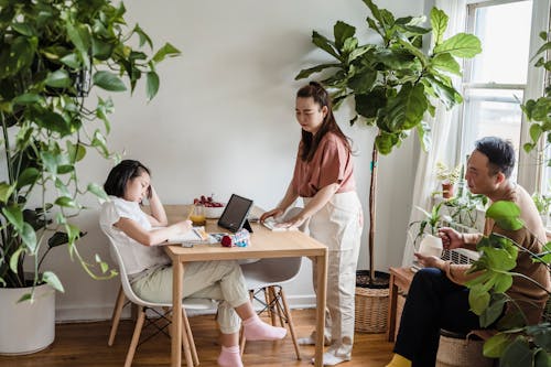 Free A Family Sitting in the Living Room Stock Photo