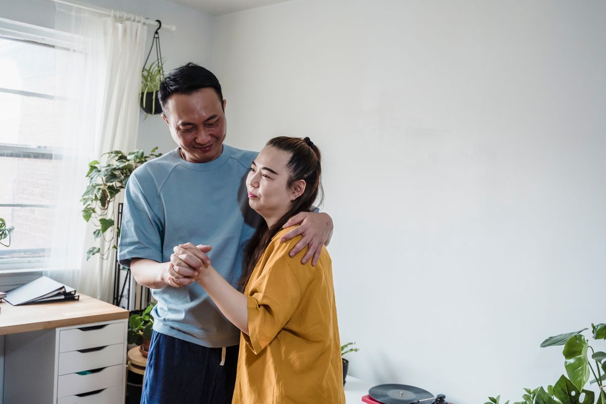 A couple sharing a quiet dance at home