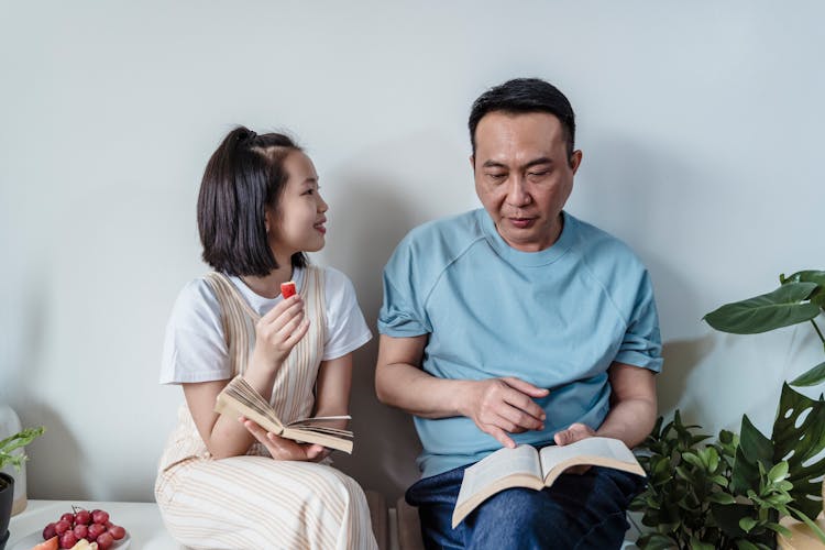 Father And Daughter Reading Books Toge