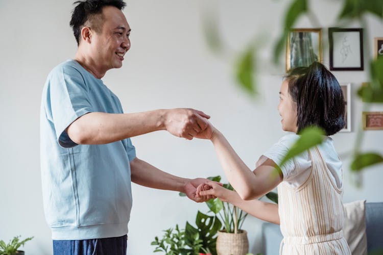 Father And Daughter Dancing Together