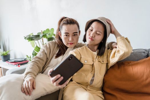 2 Women Sitting on Couch