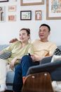 Married Couple resting on a Sofa