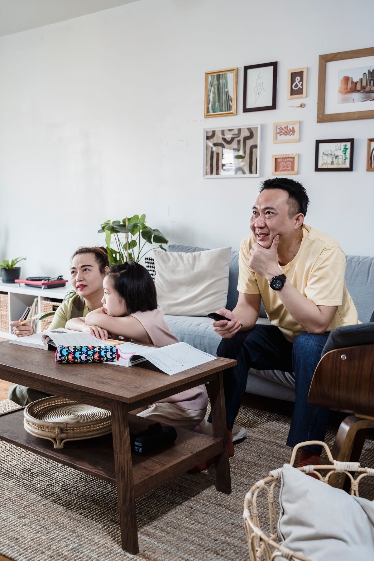 A family spending time together in a bright living room; illustrative lifestyle photography