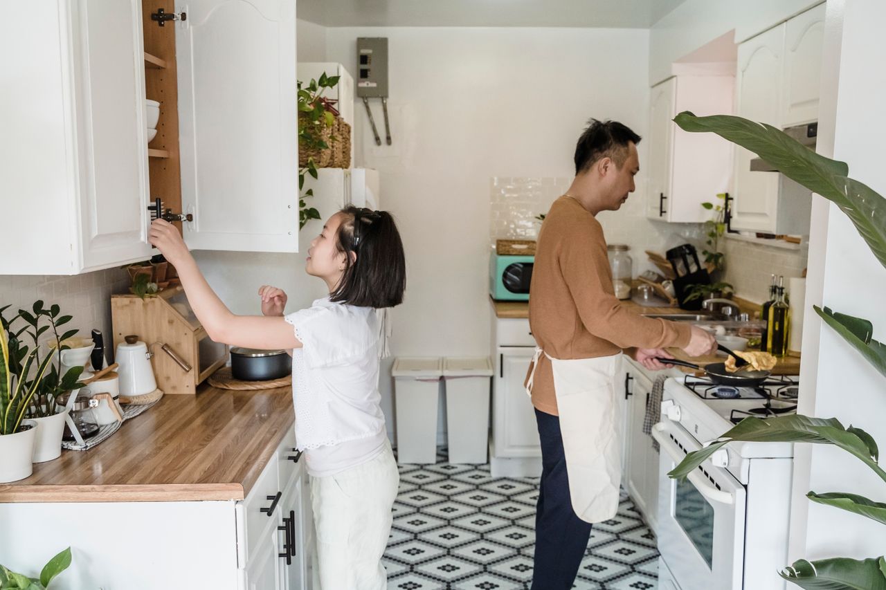 Cabinets being fitted in a kitchen