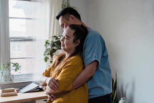 Husband hugging his Wife