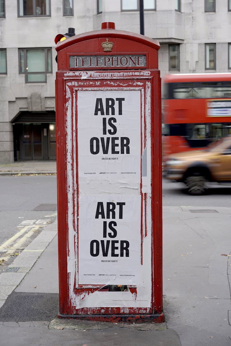 Photo Of An Advocacy On A Telephone Booth 