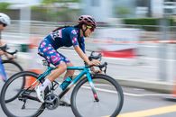 Man in Blue and Red Bicycle Helmet Riding on Blue and Black Road Bike