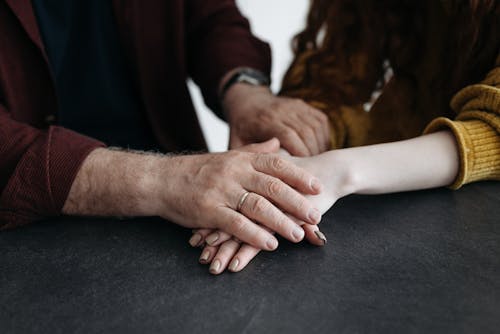 Man and Woman Holding Each Others Hand