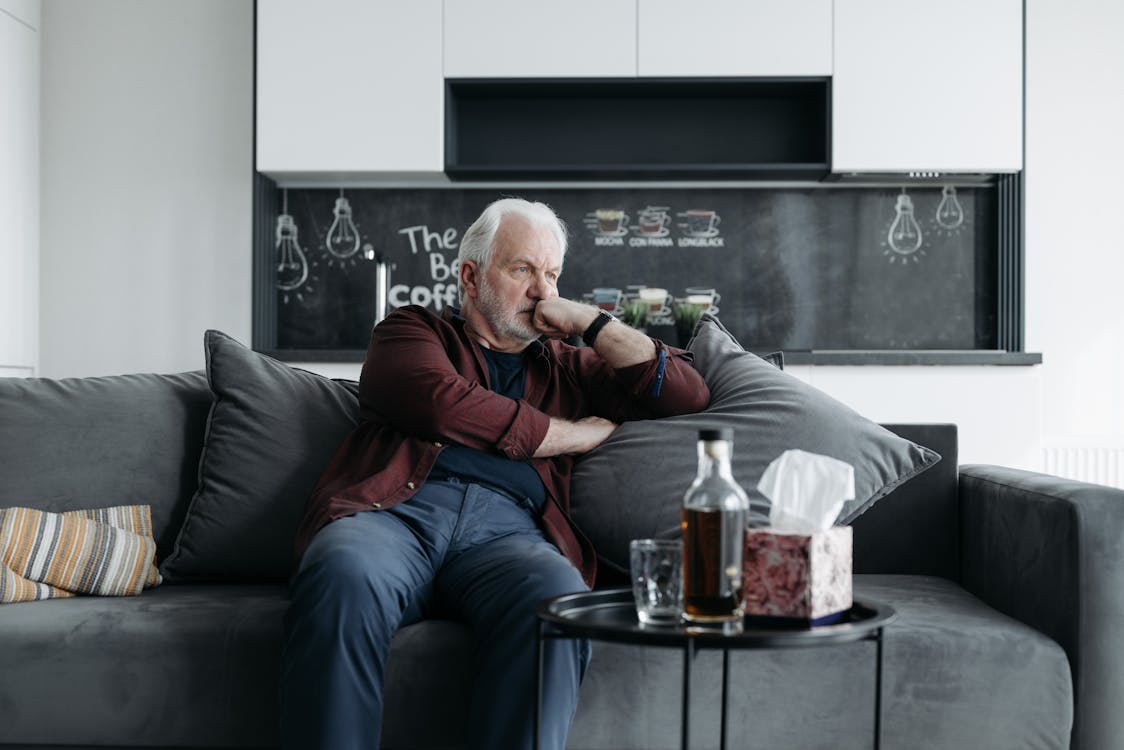 Elderly Man Sitting on the Couch · Free Stock Photo