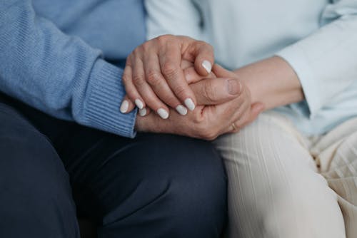 Free Man and Woman Holding Each Others Hand Stock Photo