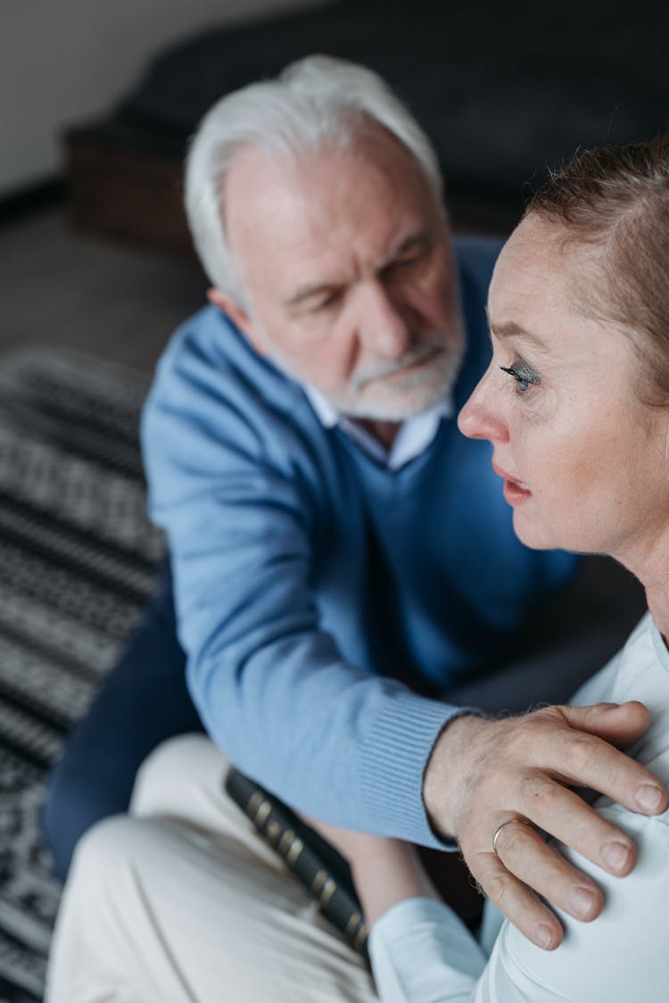 A Man Consoling His Crying Wife