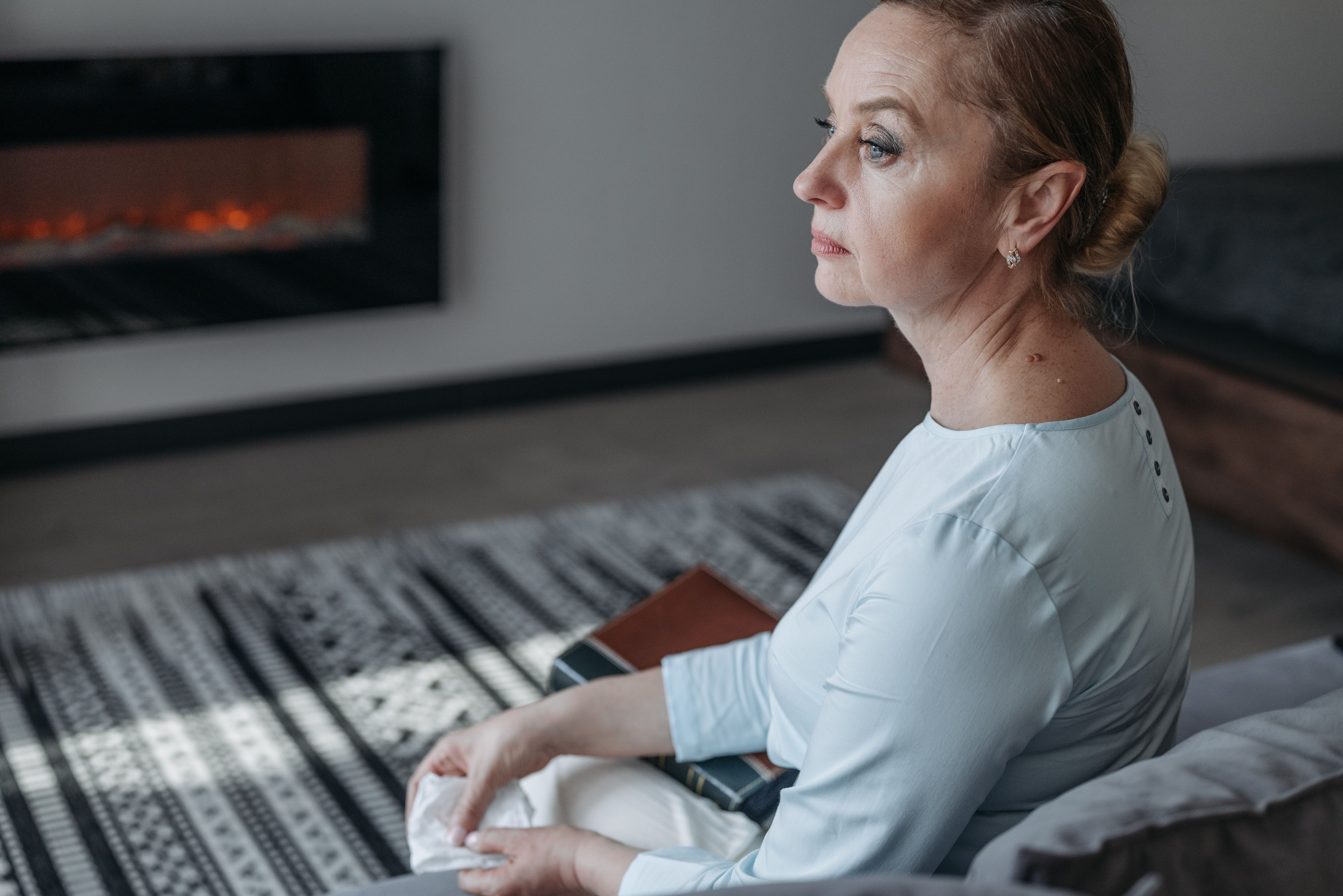 A Woman in White Long Sleeve Shirt Sitting on the Bench · Free Stock Photo