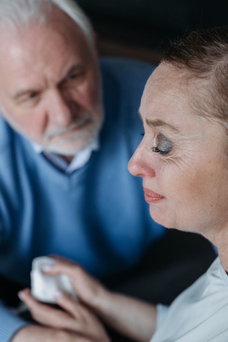 A Man Consoling His Crying Wife