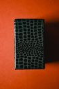 Black Rectangular Box on Orange Surface