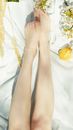 Person Holding Orange Fruit on White Textile