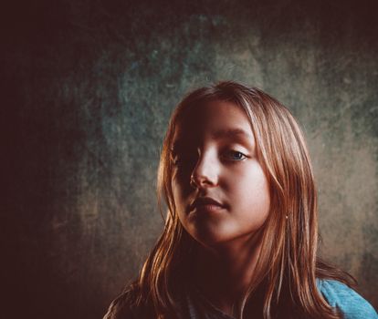 Expressive portrait of a young girl in a studio with dramatic lighting.. expressive, portrait, young