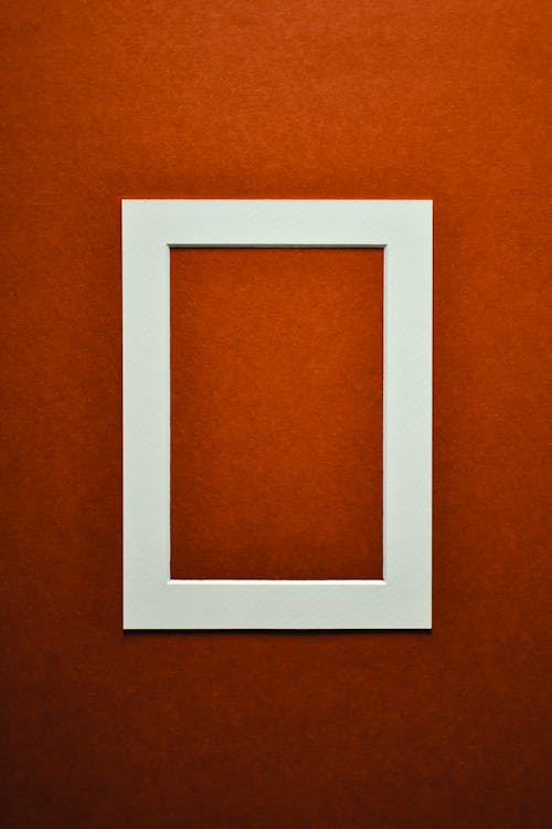 A White Photo Frame on the Red Surface