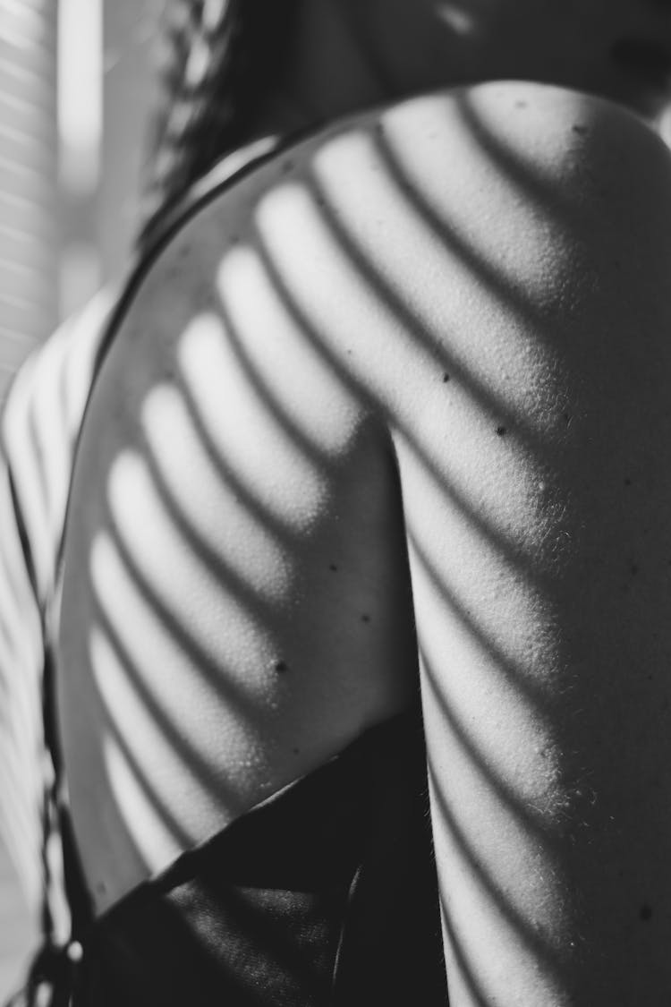 A Woman Shoulder In Black And White Photo