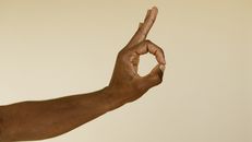 Persons Right Hand Doing Thumbs Up